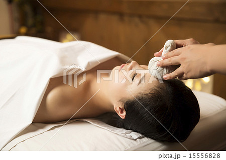 Beautiful Asian Woman in Spa Salon Getting Massage Beautiful Asian Woman in Spa Salon Getting Massage 15556828