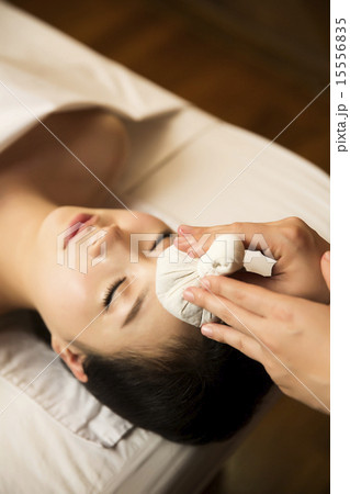 Beautiful Asian Woman in Spa Salon Getting Massage Beautiful Asian Woman in Spa Salon Getting Massage 15556835