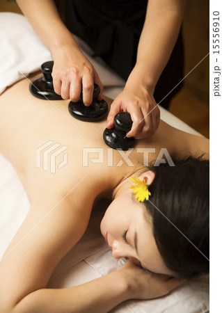 Beautiful Asian Woman in Spa Salon Getting Massage Beautiful Asian Woman in Spa Salon Getting Massage 15556910
