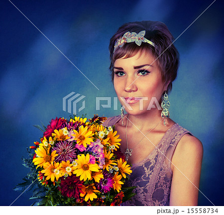 Lovely girl with a bouquet of flowers 15558734