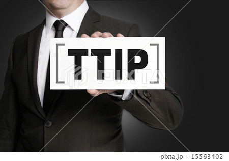 TTIP sign is held by businessman. 15563402