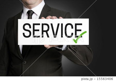 Service sign is held by businessman 15563406