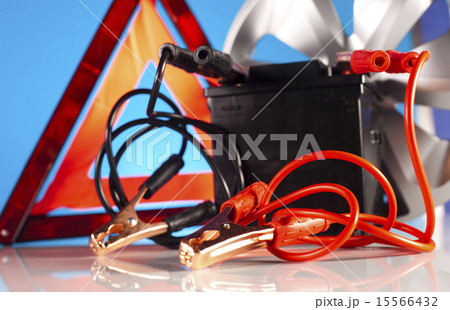Car battery with two jumper cables clipped  15566432