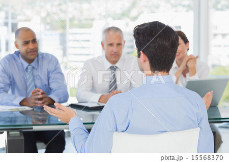 Businessman at work interview Businessman at work interview 15568370