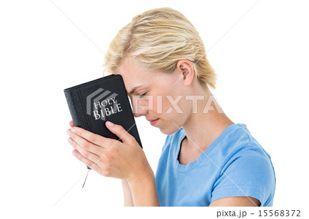 Pretty blonde woman holding bible 15568372