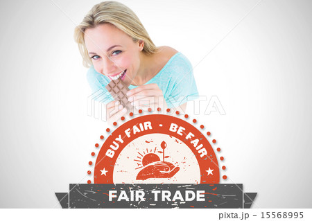 Composite image of pretty blonde eating bar of chocolate 15568995