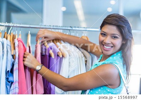 Beautiful brunette doing shopping 15568997