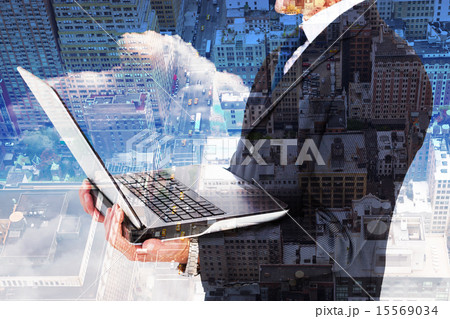 Composite image of businessman with watch using tablet pc Composite image of businessman with watch using tablet pc 15569034