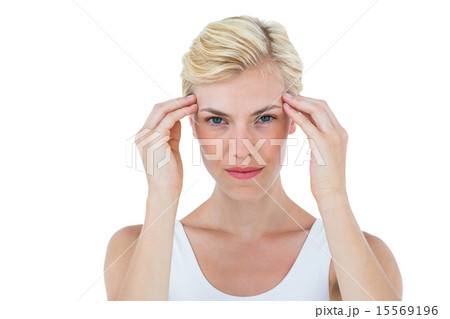 Blonde woman frowning and looking at camera 15569196