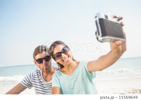 happy couple taking selfie 15569649