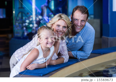 Happy family smiling to camera Happy family smiling to camera 15569673