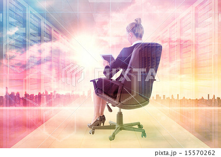 Composite image of businesswoman sitting on swivel chair with ta 15570262