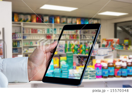 Composite image of man using tablet pc 15570348