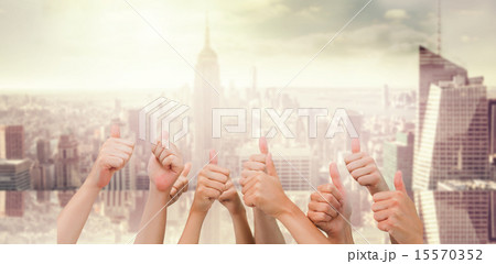 Composite image of group of hands giving thumbs up 15570352
