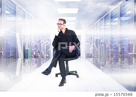Composite image of thoughtful businessman sitting on a swivel ch Composite image of thoughtful businessman sitting on a swivel ch 15570566