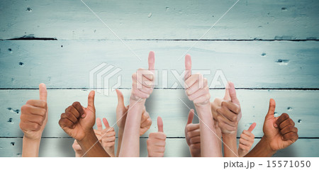Composite image of hands showing thumbs up 15571050