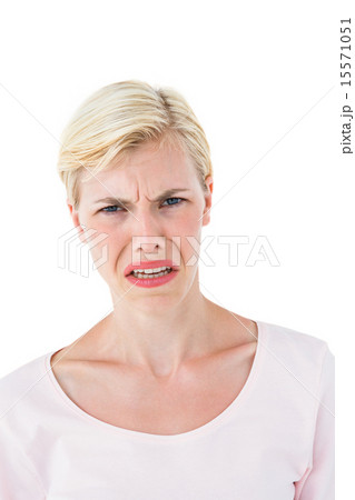 Depressed blonde woman looking at camera 15571051