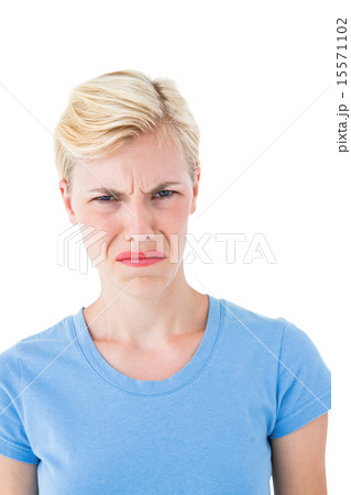 Furious blonde woman looking at camera Furious blonde woman looking at camera 15571102