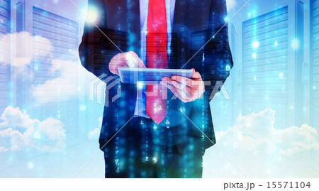 Composite image of businessman scrolling on his digital tablet 15571104