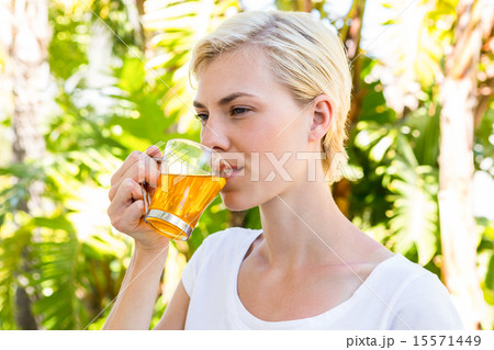 Attractive blonde woman drinking tea Attractive blonde woman drinking tea 15571449