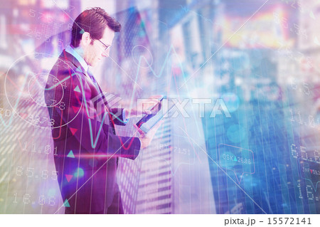Composite image of businessman standing while using a tablet pc Composite image of businessman standing while using a tablet pc 15572141