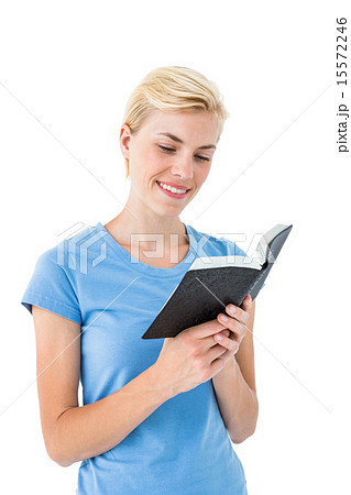 Pretty blonde woman reading bible 15572246