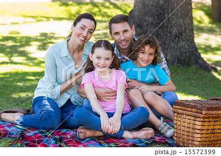 Happy family on a picnic in the park Happy family on a picnic in the park 15572399