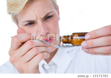 Doctor pouring medicine in spoon 15573765