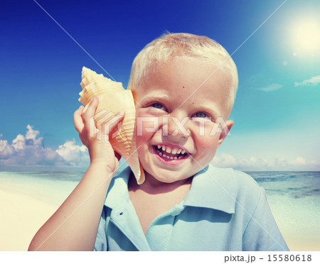 Little Boy Beach Seashell Fun Vacation Concept Little Boy Beach Seashell Fun Vacation Concept 15580618
