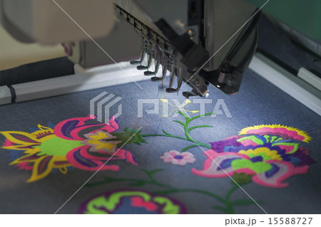 Professional machine applying embroidery on tissue Professional machine applying embroidery on tissue 15588727