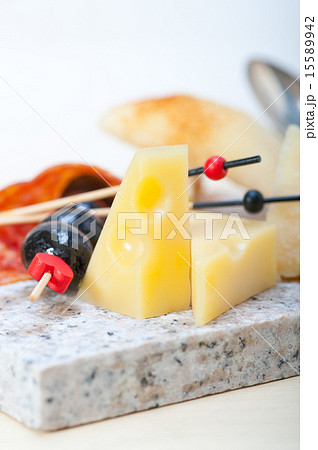 mix cold cut on a stone with fresh pears 15589942