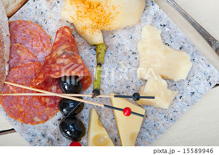 mix cold cut on a stone with fresh pears 15589946