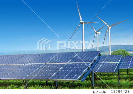 solar panels and wind turbines under blue sky 15594428