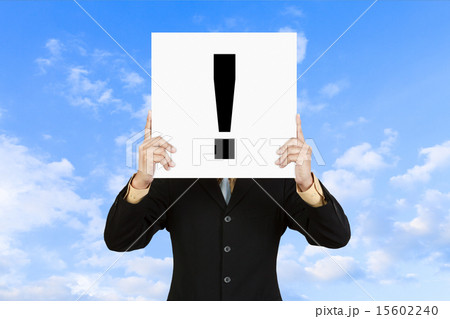 Businessman show exclamation mark on paper board 15602240