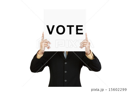 Businessman show wording VOTE on paper board Businessman show wording VOTE on paper board 15602299