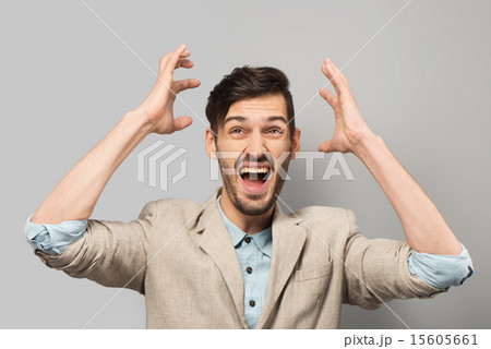 Young man cheerfully smiling Young man cheerfully smiling 15605661