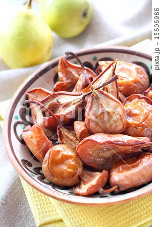 Baked pears on a folk style plate 15606986