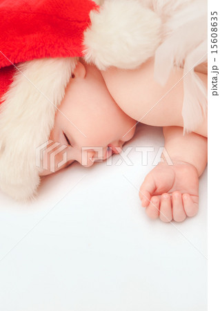 Small boy sleeping in a New Year's cap Small boy sleeping in a New Year's cap 15608635