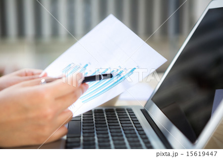 Close-up of business person use laptop  15619447