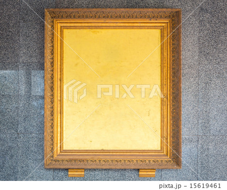 Antique golden frame on wall 15619461