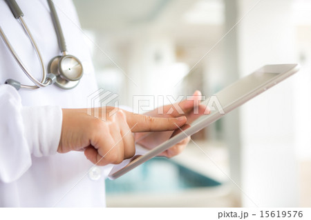 Doctor using tablet computer Doctor using tablet computer 15619576