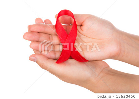 AIDS ribbon in hand isolated on white background AIDS ribbon in hand isolated on white background 15620450