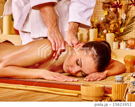 Therapist giving stretching massage to woman. 15623952