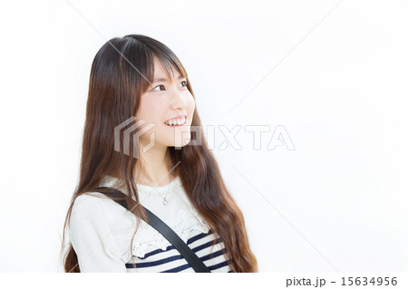 ウェーブのロングヘアが似合う色白の女の子の写真素材