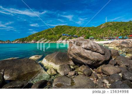 rocks on the beach with blue sky and mountain rocks on the beach with blue sky and mountain 15634998