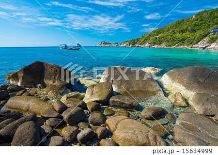 Rock beach and blue sky with beautiful clouds Rock beach and blue sky with beautiful clouds 15634999
