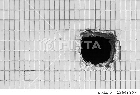 Hole on the old white wall Hole on the old white wall 15643807