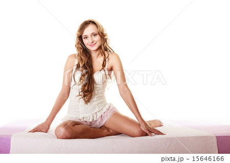 woman long curly hair relaxing on her bed at morning woman long curly hair relaxing on her bed at morning 15646166