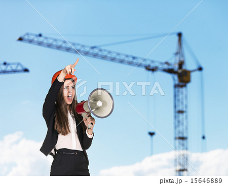 Woman-builder in hardhat screaming 15646889