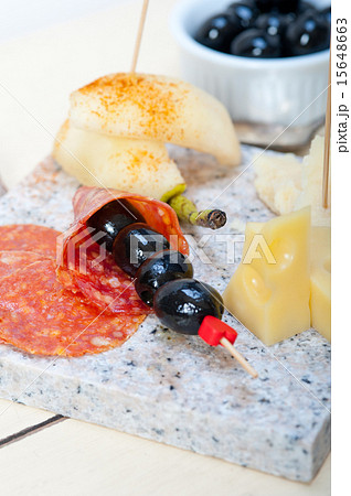 mix cold cut on a stone with fresh pears 15648663